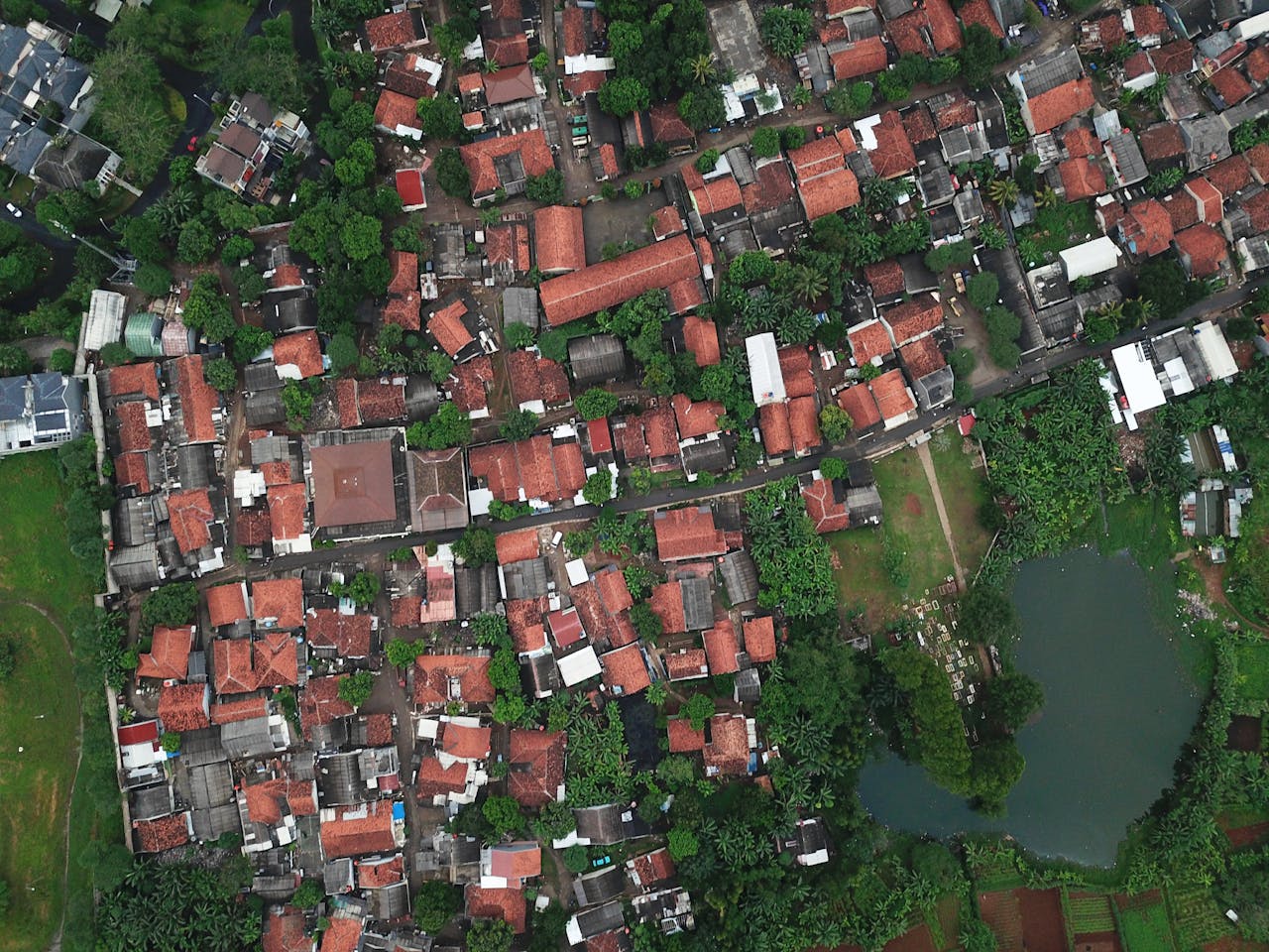our-services-1 A top-down view of rooftops and greenery in Serpong, Banten, Indonesia.